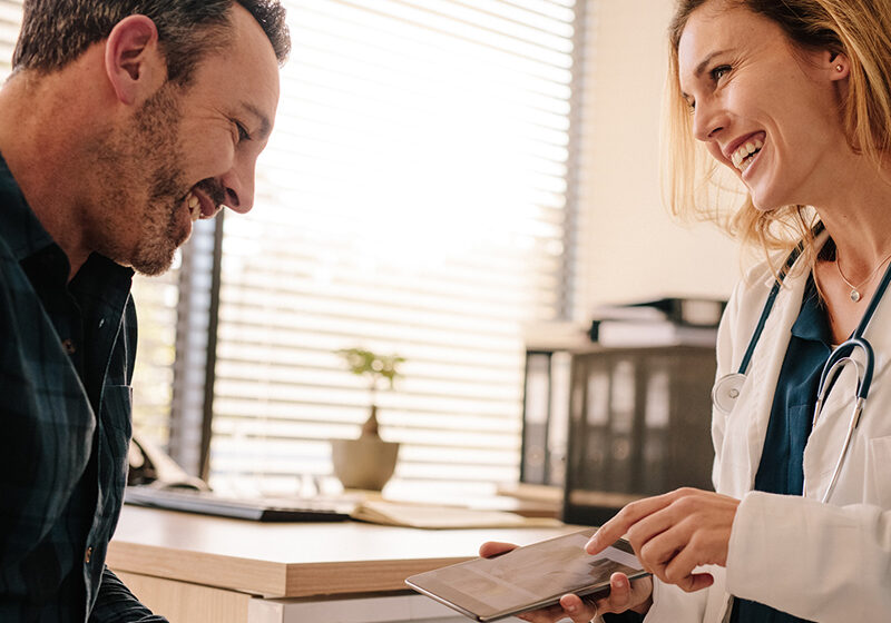 Doctor giving patient good news